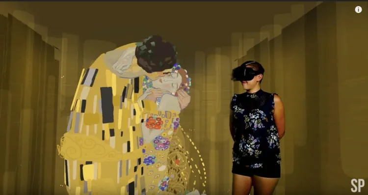 Estella Tse: in a VR headset beside a VR rendition of Klimt’s The Kiss