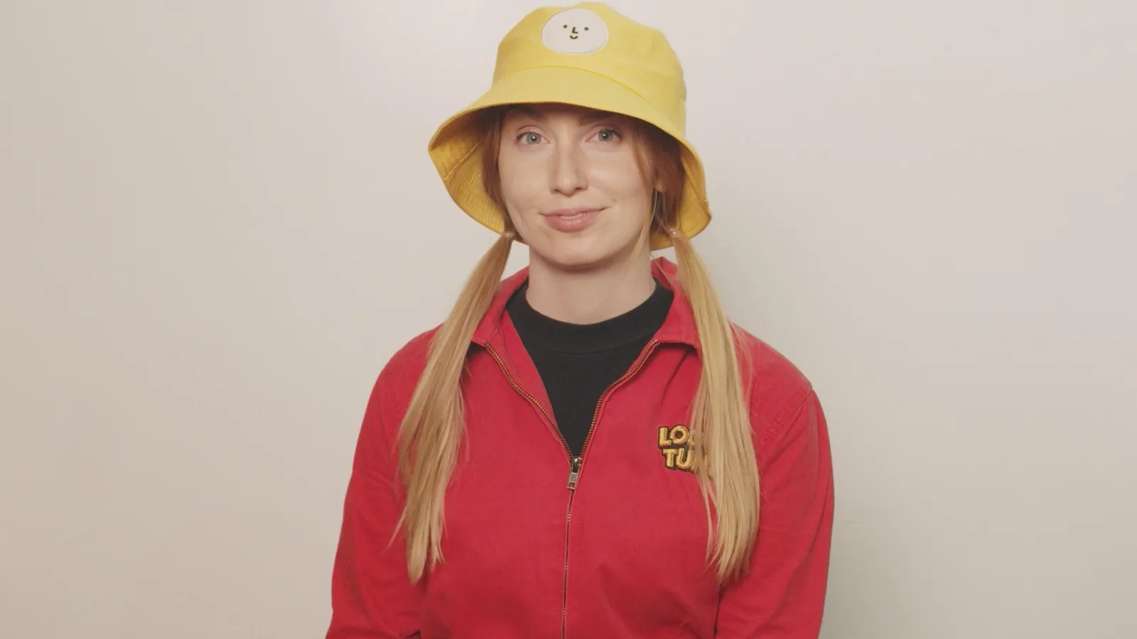 Kami Karras: portrait in a yellow bucket hat